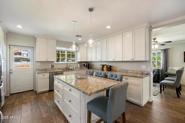 a kitchen with a stove a sink and a refrigerator