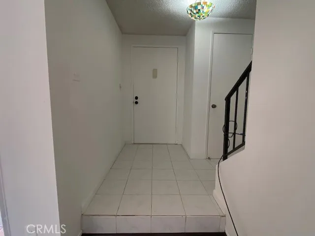 a view of a hallway with staircase