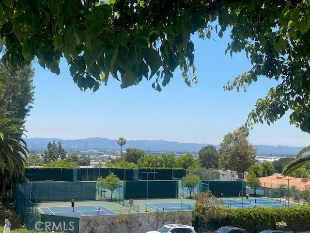 a view of a chairs and table in a backyard