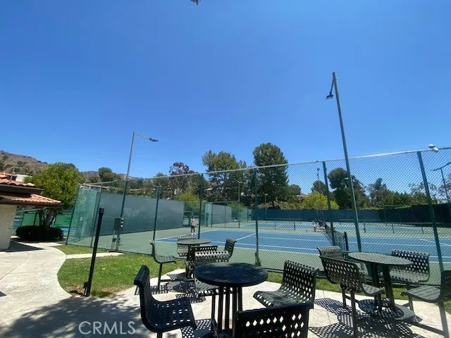 a view of a chairs and table in patio