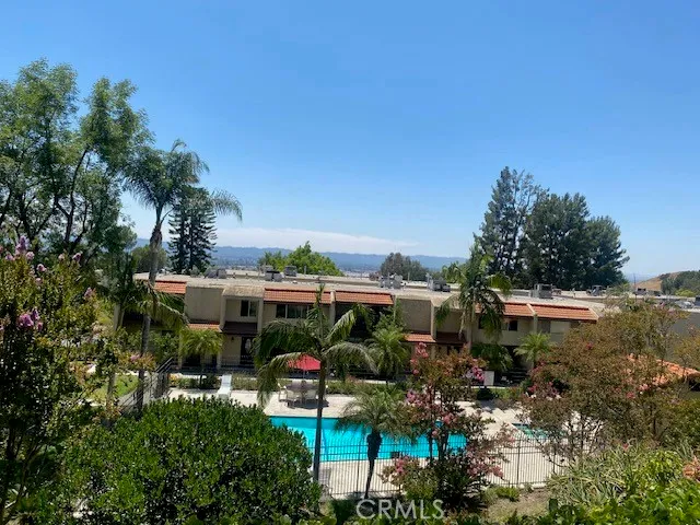 a view of a house with a door and wooden wall