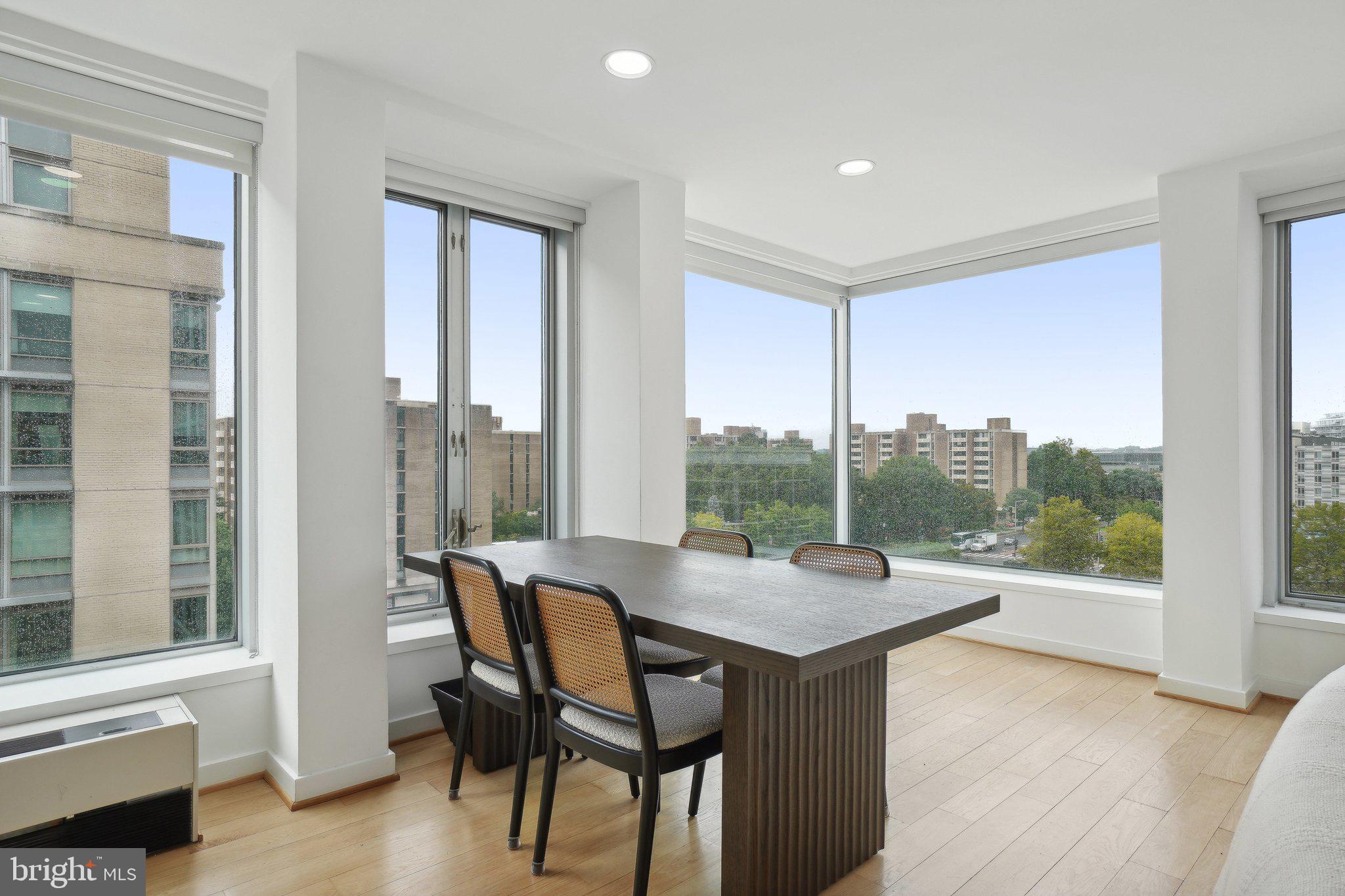 1101 3rd Street Southwest, Unit 706 Washington, DC 20024 - Photo 10 of 26 a dining room with furniture and wooden floor