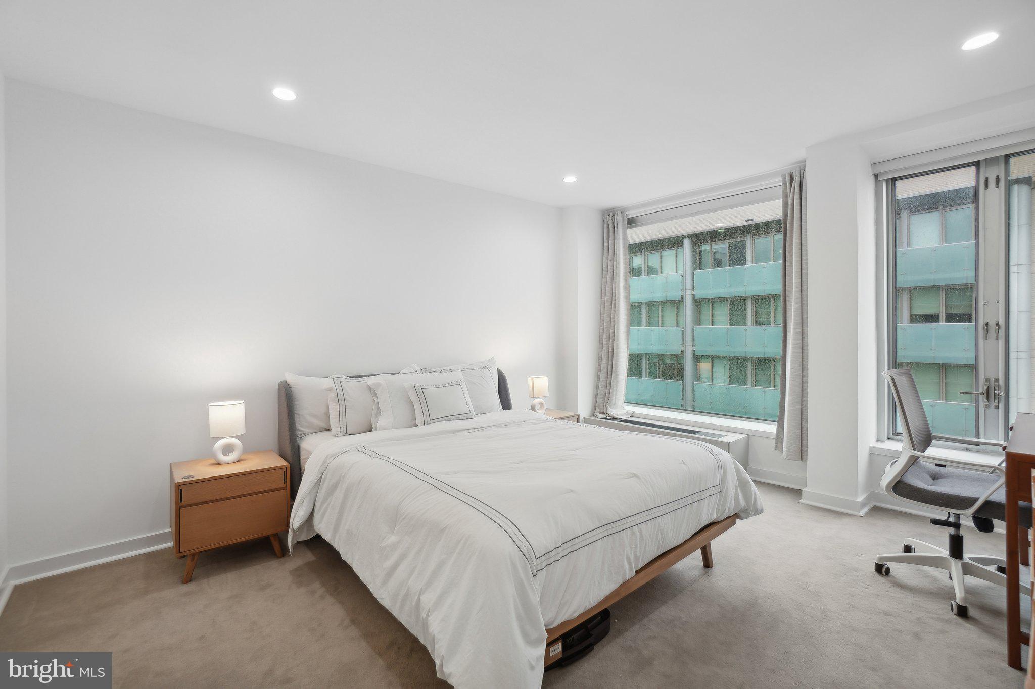 1101 3rd Street Southwest, Unit 706 Washington, DC 20024 - Photo 18 of 26 a bedroom with a bed chair and a window