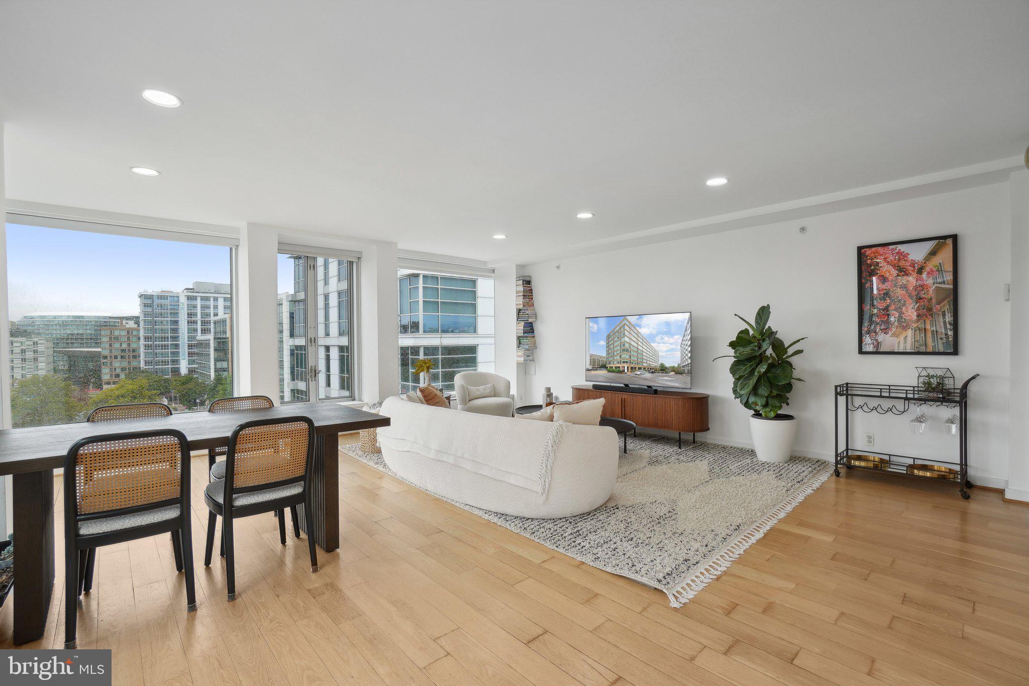 1101 3rd Street Southwest, Unit 706 Washington, DC 20024 - Photo 25 of 26 a living room with furniture and a table