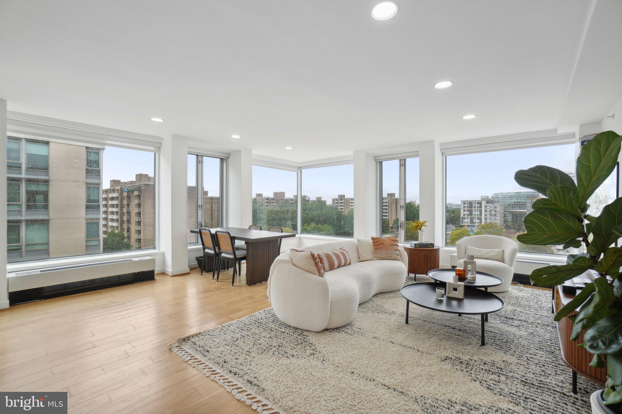 1101 3rd Street Southwest, Unit 706 Washington, DC 20024 - Photo 3 of 26 a living room with furniture and a large window
