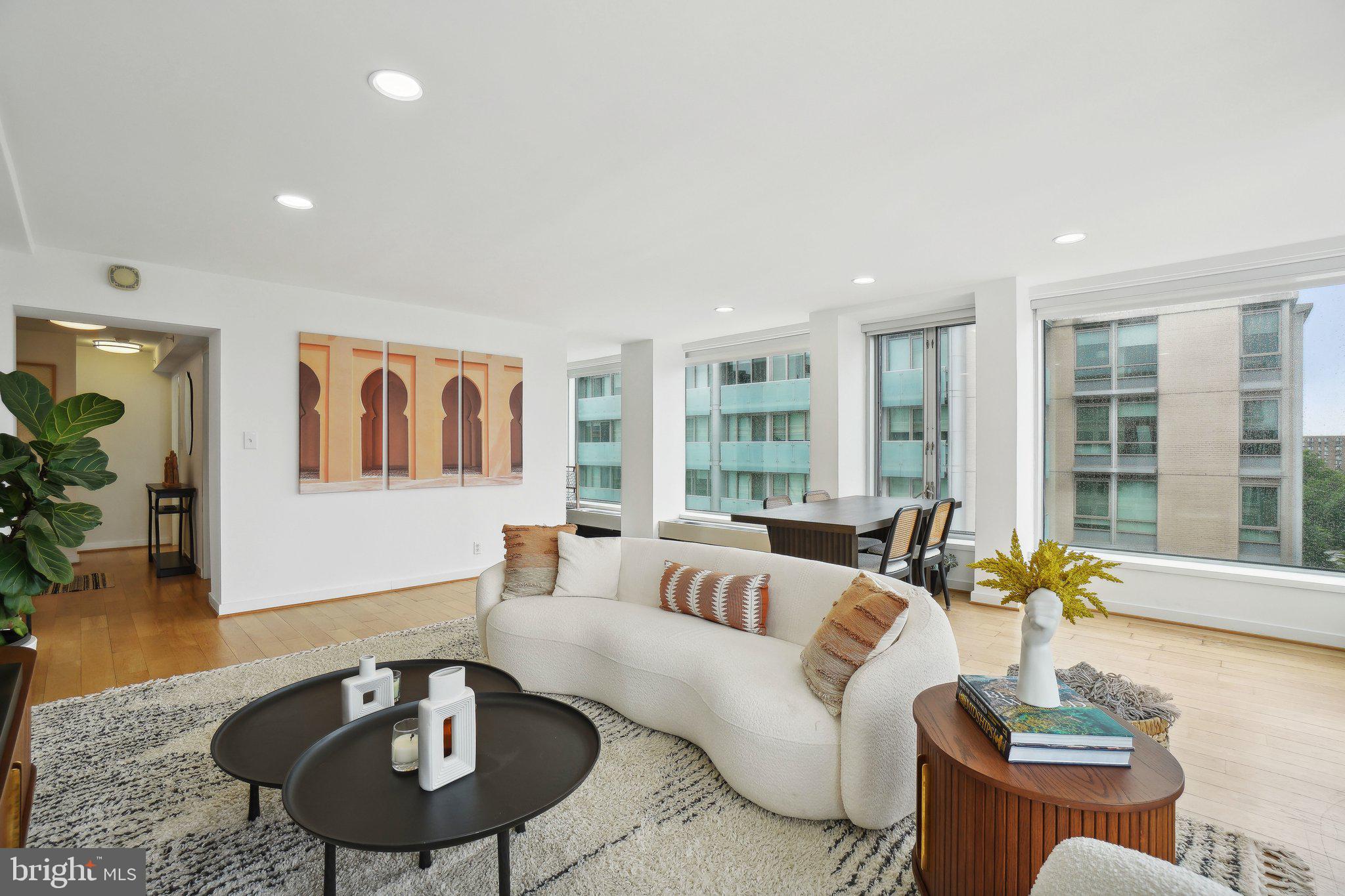 1101 3rd Street Southwest, Unit 706 Washington, DC 20024 - Photo 8 of 26 a living room with furniture and a table