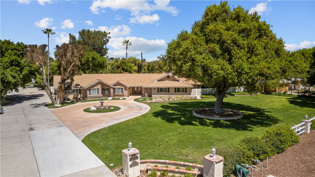 21907 Placeritos Boulevard Newhall, CA 91321 - Photo 1 of 1 a view of a house with swimming pool and yard