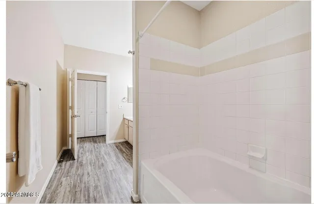 a bathroom with a bathtub and a shower