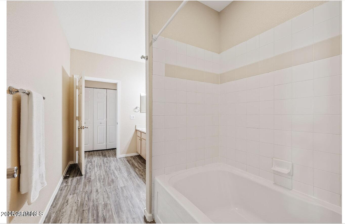 3236 East Chandler Boulevard, Unit 1079 Phoenix, AZ 85048 - Photo 12 of 17 a bathroom with a bathtub and a shower