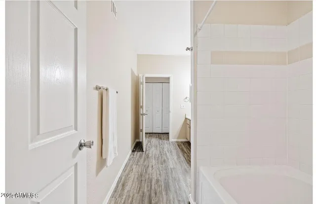 a view of a bedroom from a hallway