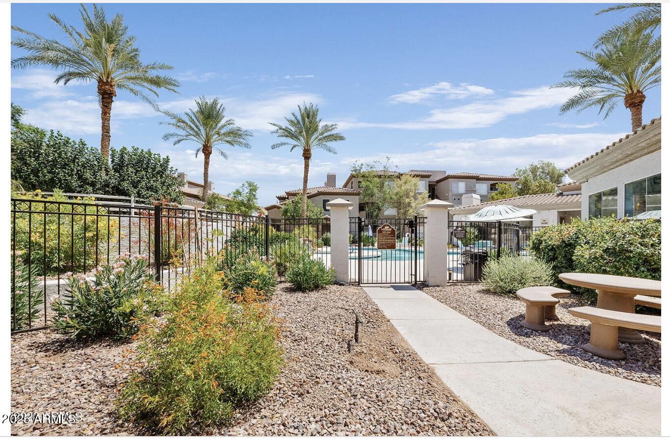 3236 East Chandler Boulevard, Unit 1079 Phoenix, AZ 85048 - Photo 16 of 17 a view of a garden with a sitting area
