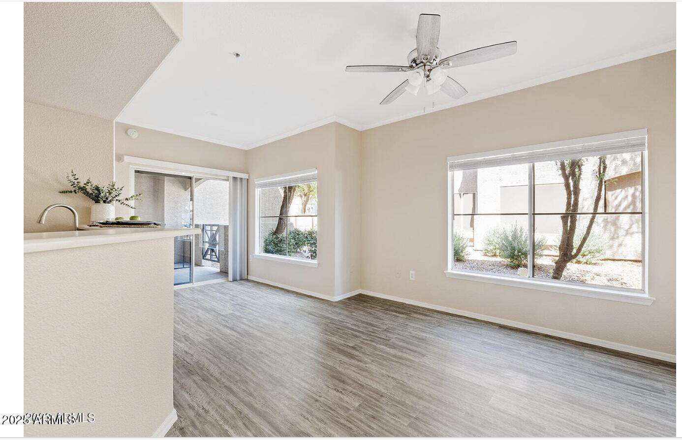 3236 East Chandler Boulevard, Unit 1079 Phoenix, AZ 85048 - Photo 6 of 17 a room with a window and a kitchen view