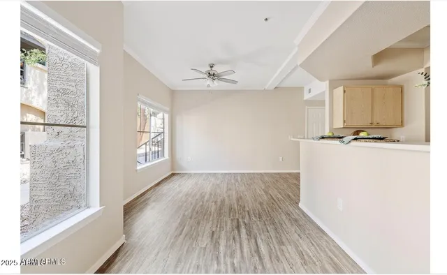 a view of kitchen with sink and wooden floor
