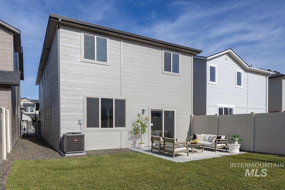 205 West Broyhill Street Meridian, ID 83642 - Photo 12 of 20 Back of property featuring a fenced backyard, outdoor furniture, and a patio area