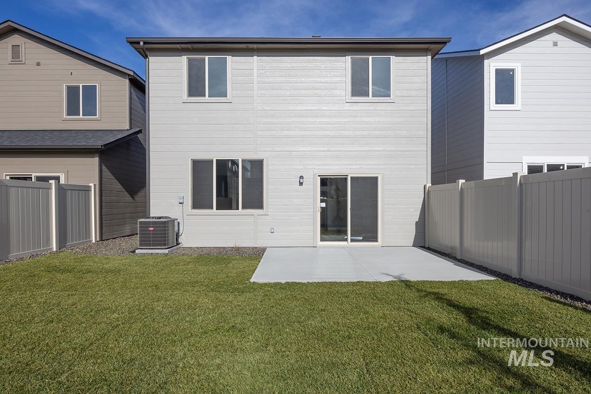 205 West Broyhill Street Meridian, ID 83642 - Photo 13 of 20 Rear view of property with a fenced backyard and a patio