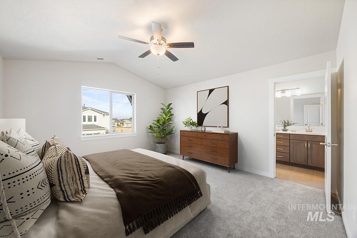 205 West Broyhill Street Meridian, ID 83642 - Photo 8 of 20 Bedroom with lofted ceiling, light carpet, a ceiling fan, and ensuite bathroom