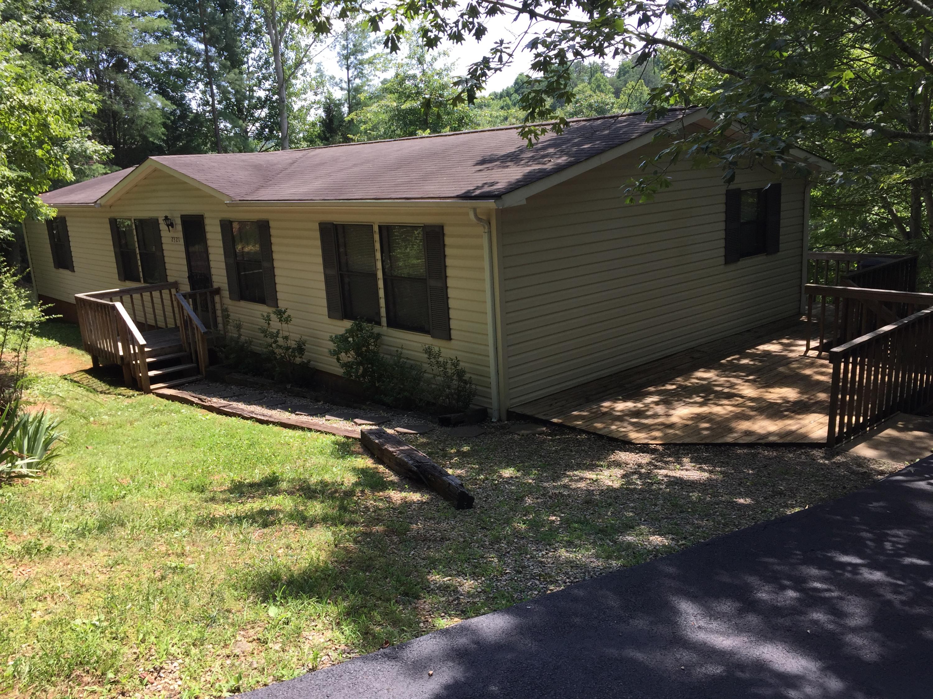 2321 Navigation Point Goodview, VA 24095 - Photo 1 of 26 a backyard of a house with yard and outdoor seating