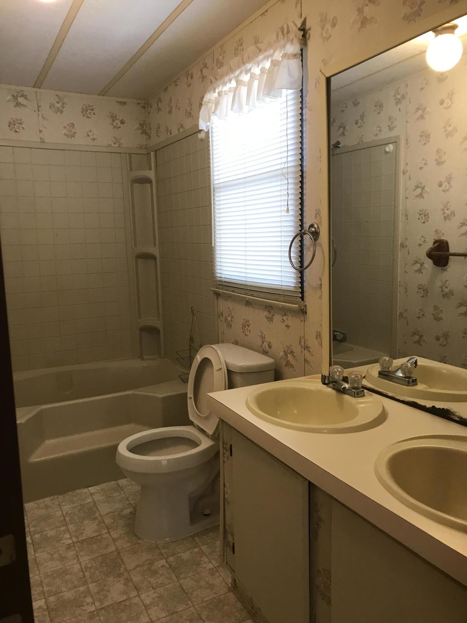 2321 Navigation Point Goodview, VA 24095 - Photo 12 of 26 a bathroom with a sink toilet and shower