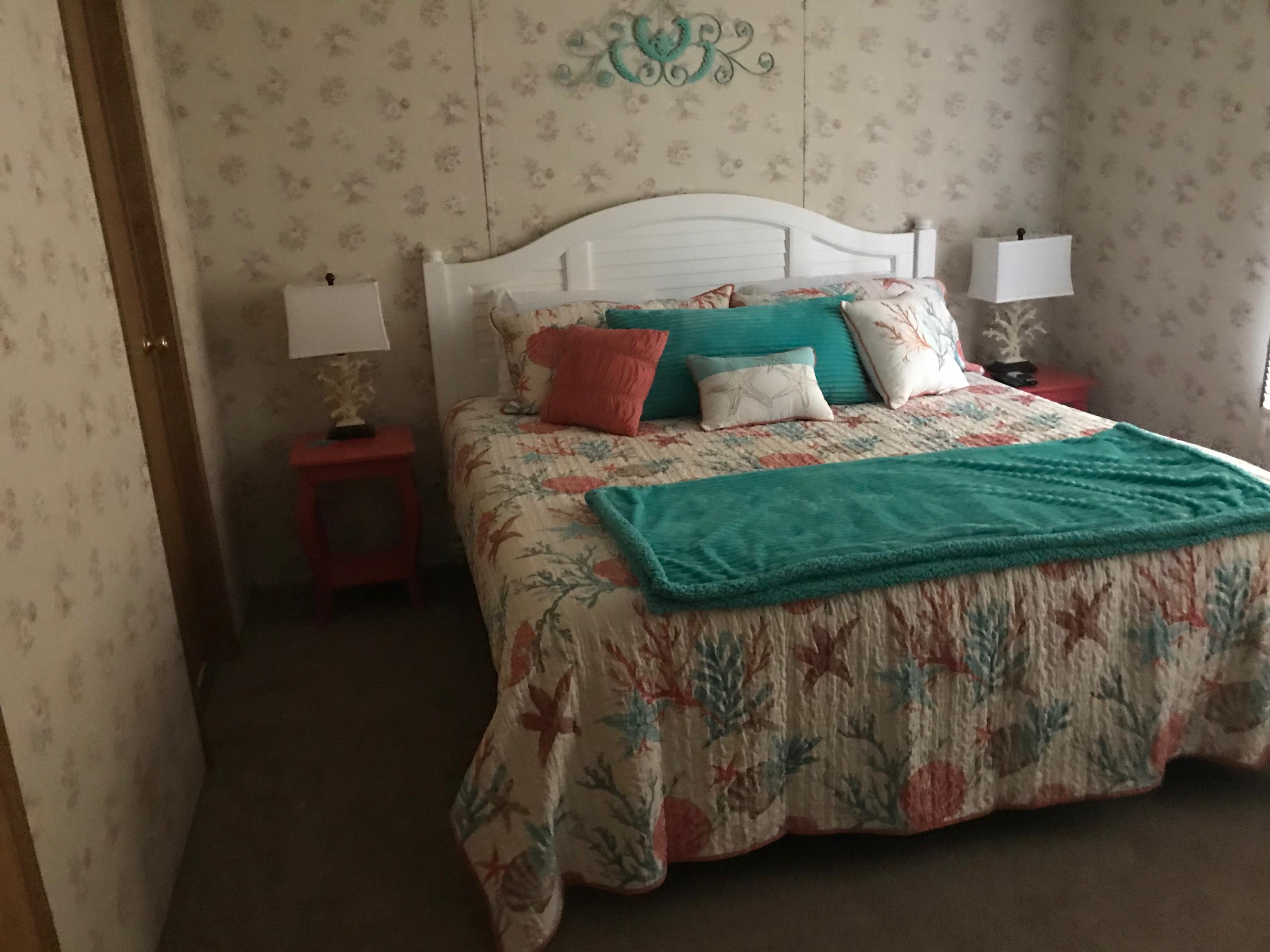 2321 Navigation Point Goodview, VA 24095 - Photo 15 of 26 a bed sitting in a bedroom next to a window