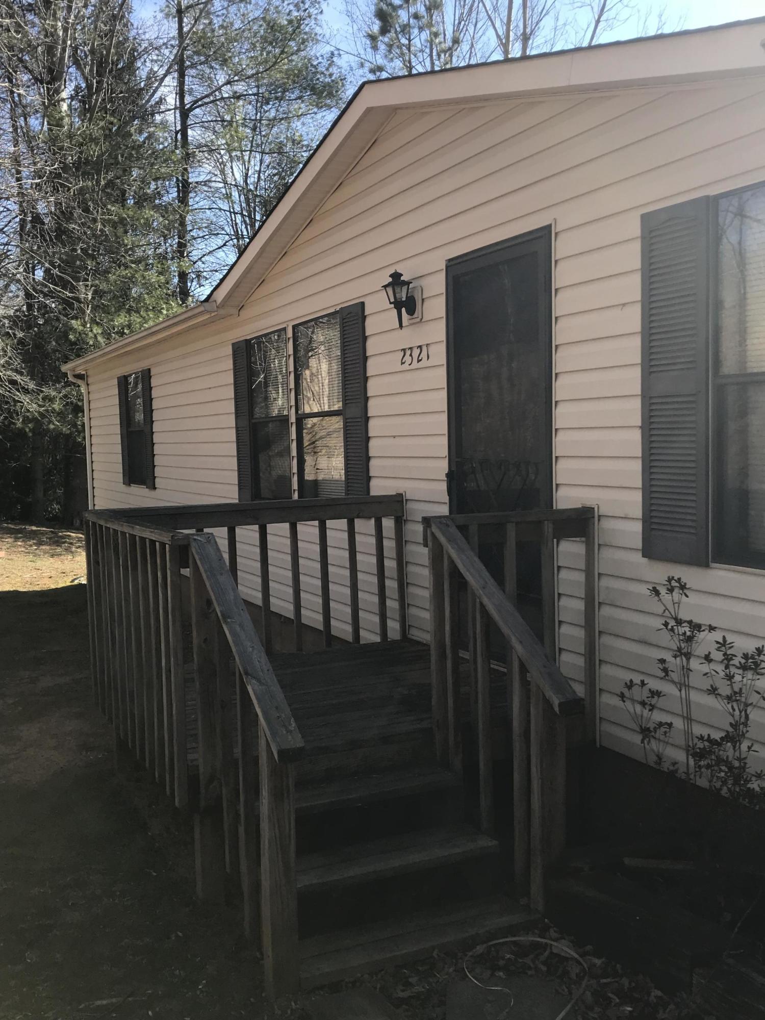2321 Navigation Point Goodview, VA 24095 - Photo 3 of 26 a view of wooden house with a deck