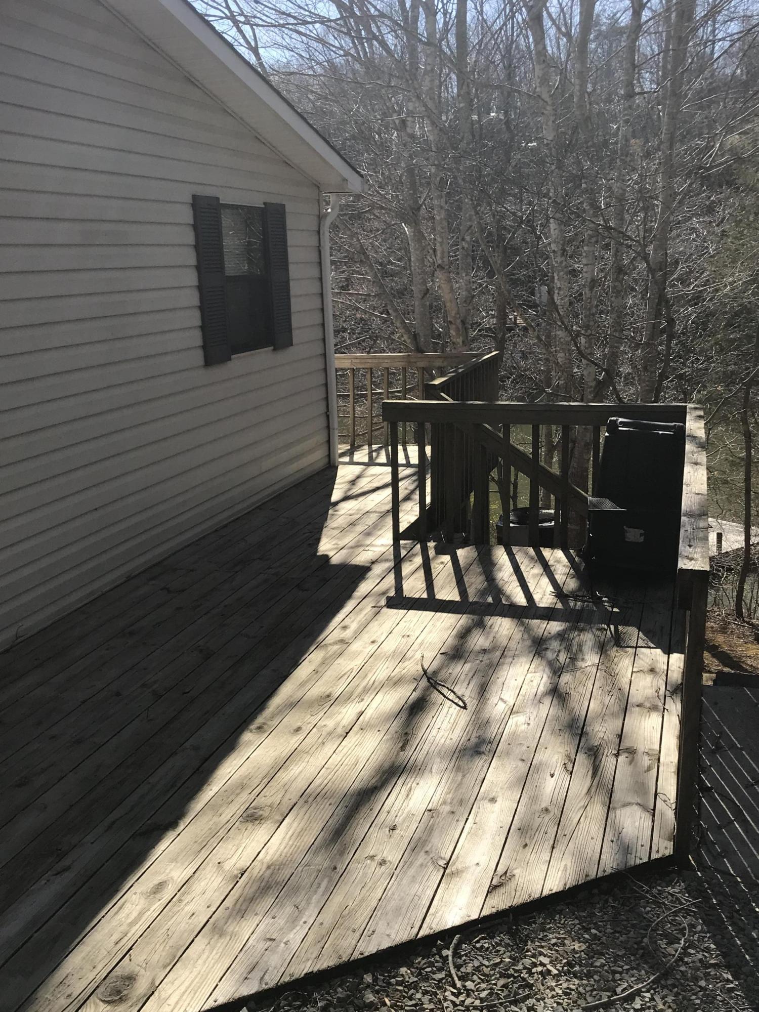 2321 Navigation Point Goodview, VA 24095 - Photo 4 of 26 a terrace with outdoor seating and wooden floor