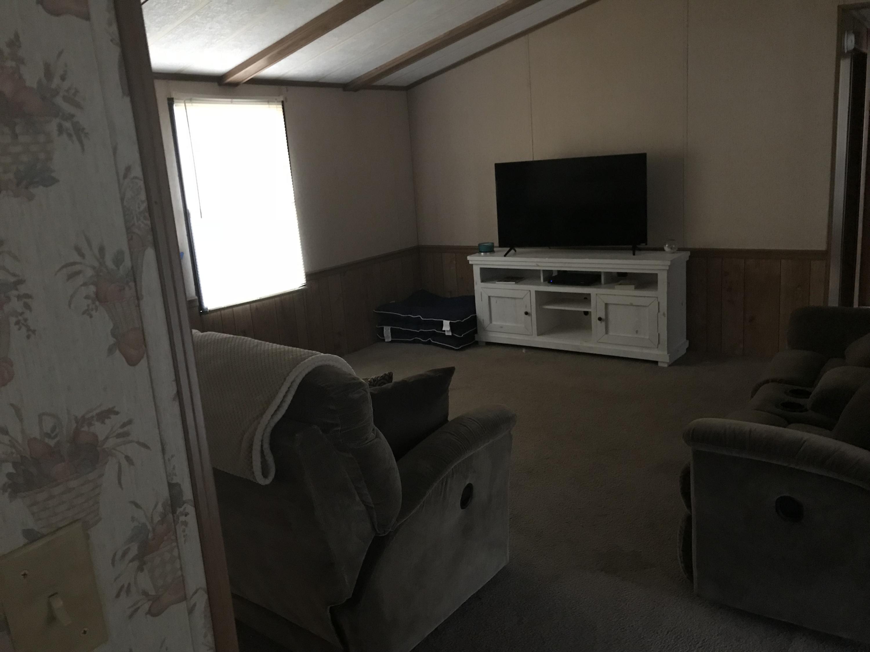 2321 Navigation Point Goodview, VA 24095 - Photo 7 of 26 a living room with furniture and a flat screen tv