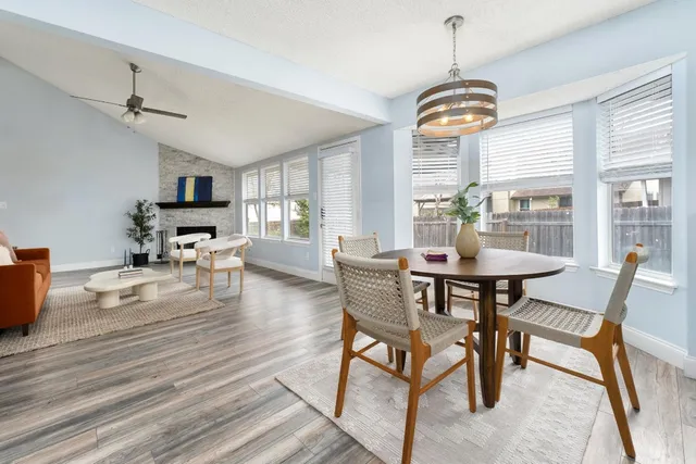 a view of a dining room with furniture window and wooden floor