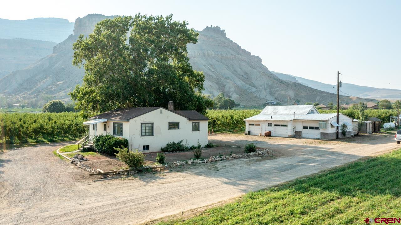 706 39 Road Palisade, CO 81526 - Photo 2 of 35 a view of house with outdoor space and street view