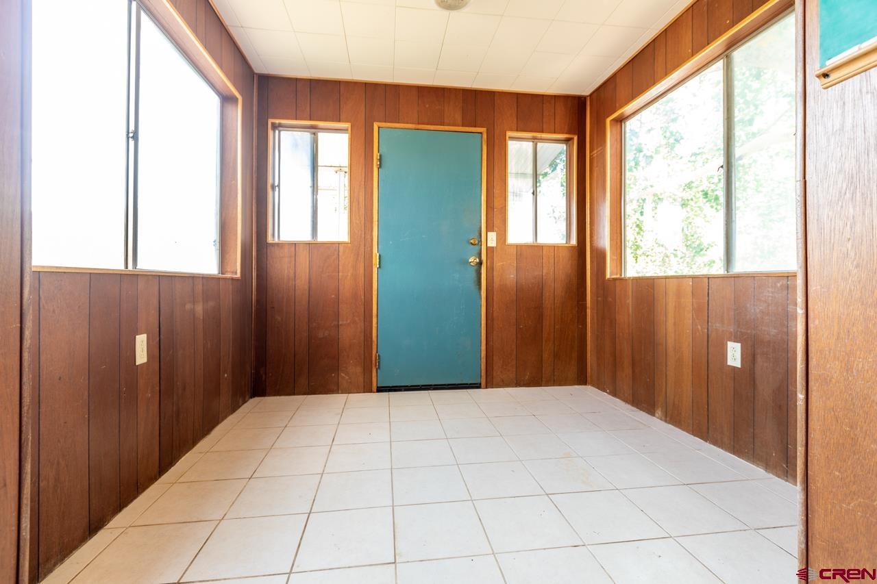 706 39 Road Palisade, CO 81526 - Photo 5 of 35 a view of an empty room with a window