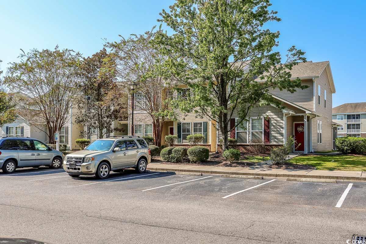 308 Kiskadee Loop, Unit E Conway, SC 29526 - Photo 1 of 28 View of uncovered parking lot