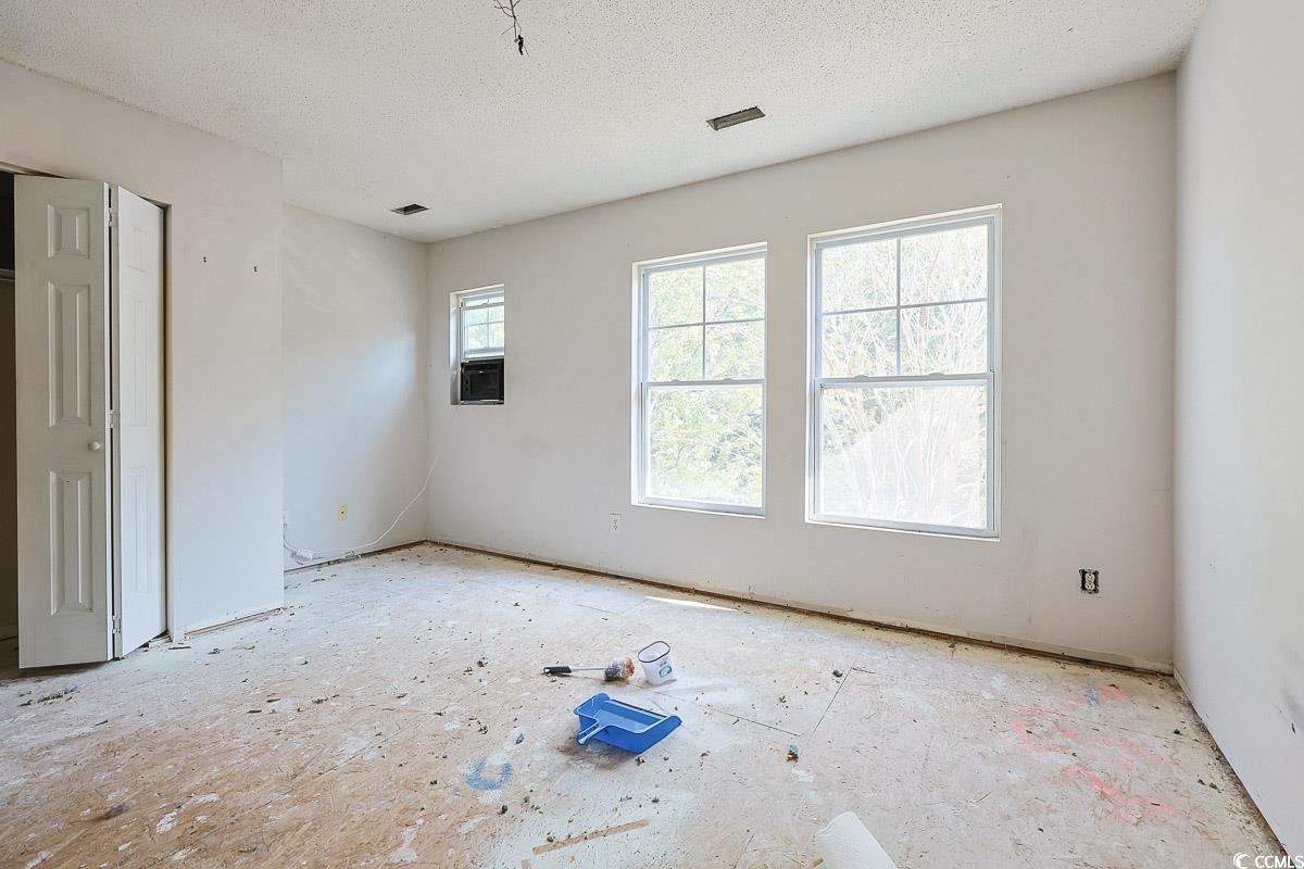 308 Kiskadee Loop, Unit E Conway, SC 29526 - Photo 15 of 28 Spare room with a textured ceiling