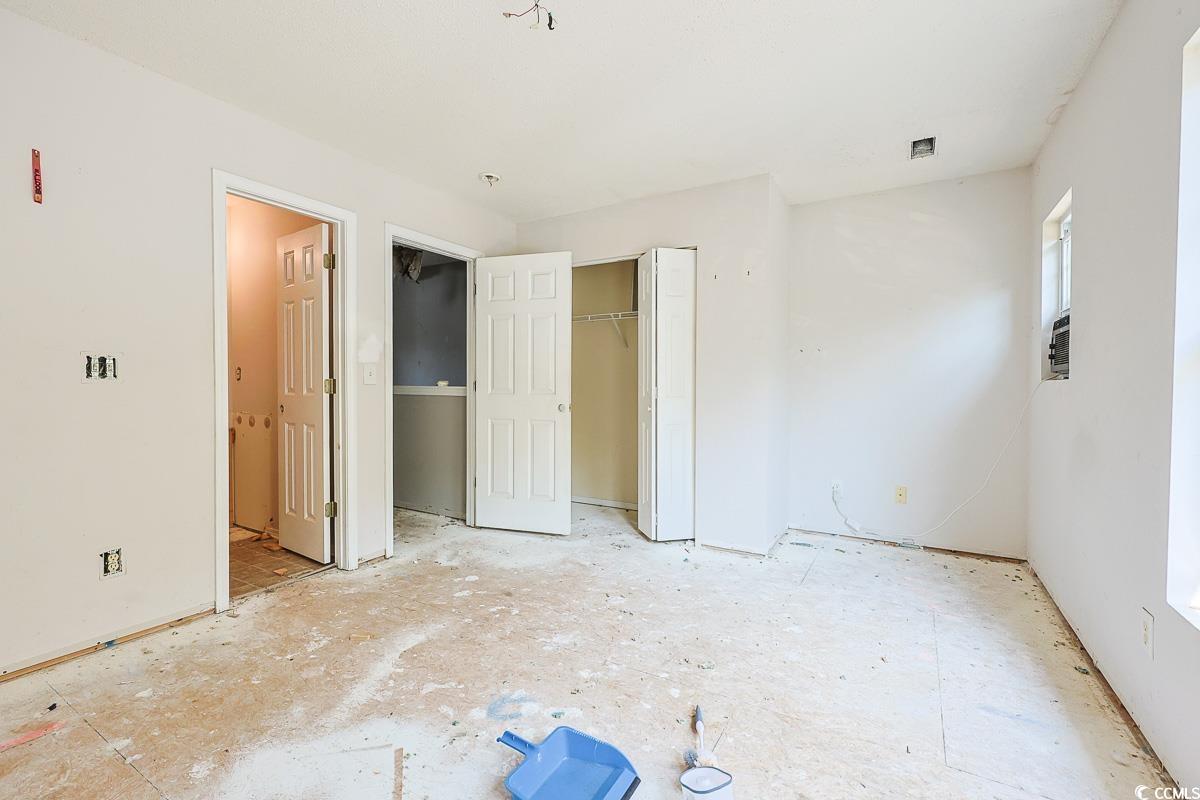 308 Kiskadee Loop, Unit E Conway, SC 29526 - Photo 16 of 28 Unfurnished bedroom featuring a closet