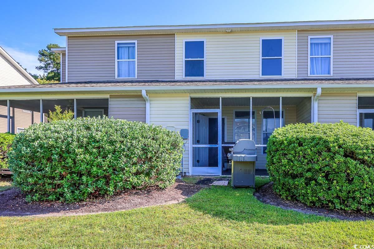 308 Kiskadee Loop, Unit E Conway, SC 29526 - Photo 22 of 28 View of front of home featuring a sunroom and a front lawn