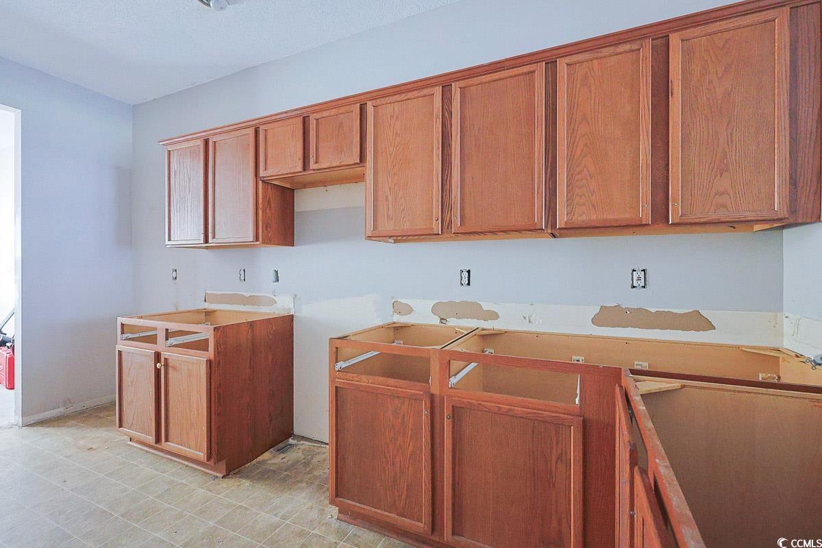 308 Kiskadee Loop, Unit E Conway, SC 29526 - Photo 6 of 28 Kitchen featuring brown cabinetry