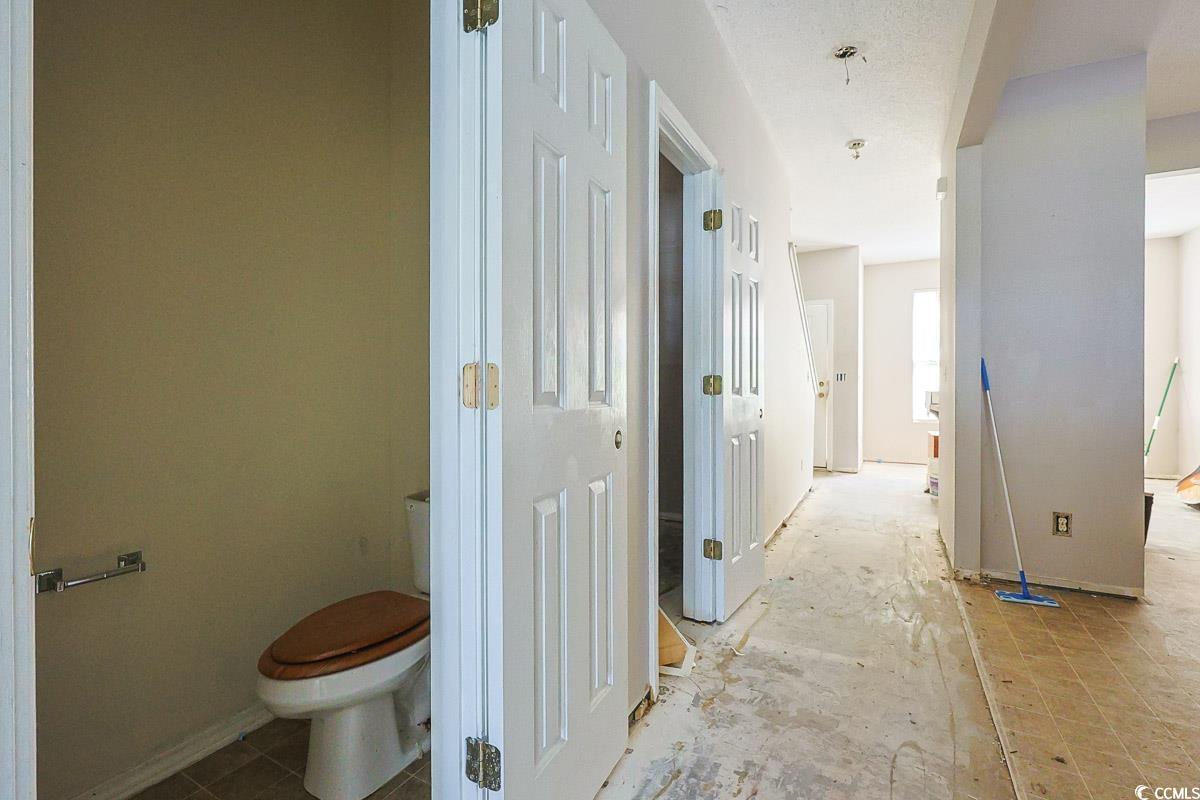 308 Kiskadee Loop, Unit E Conway, SC 29526 - Photo 9 of 28 Bathroom featuring toilet and baseboards