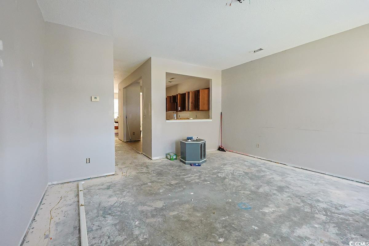 308 Kiskadee Loop, Unit E Conway, SC 29526 - Photo 10 of 28 Unfurnished living room with baseboards