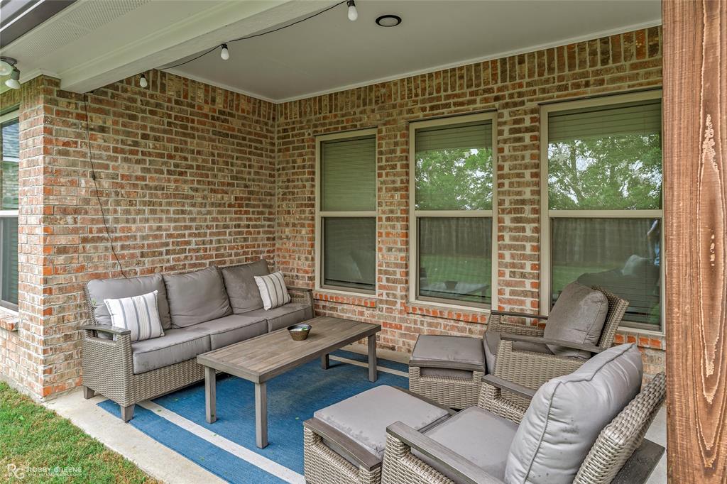 122 Brimestone Loop Benton, LA 71006 - Photo 32 of 33 a outdoor living space with furniture and a potted plant