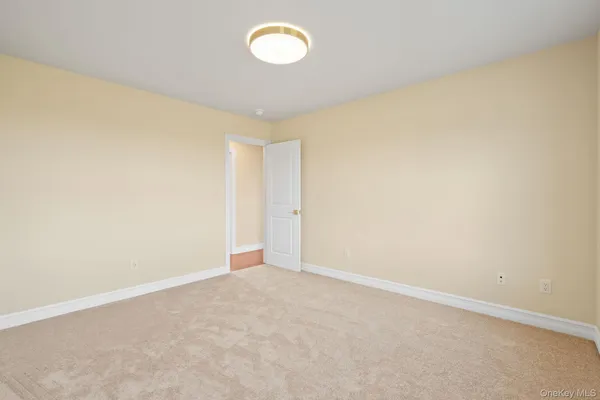 an empty room with a empty space and a window
