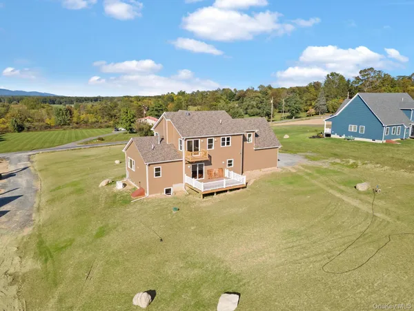 an aerial view of residential house with an ocean view