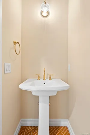 a bathroom with a sink a mirror and vanity