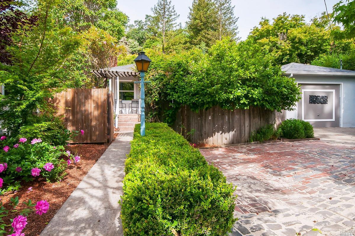 295 Butterfield Road San Anselmo, CA 94960 - Photo 1 of 1 a front view of a house with garden