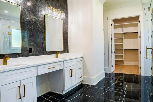 a view of a kitchen with stainless steel appliances granite countertop a refrigerator and a sink