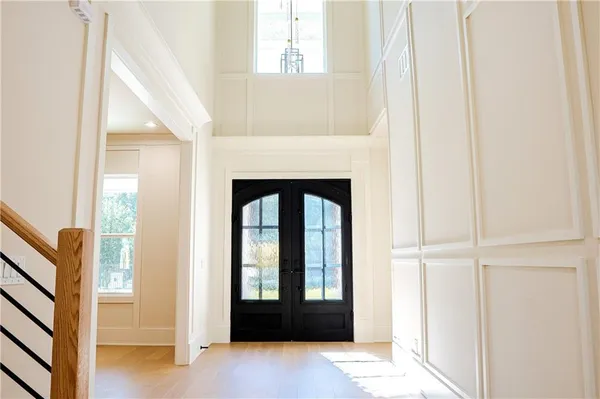 a view of an entryway with wooden floor