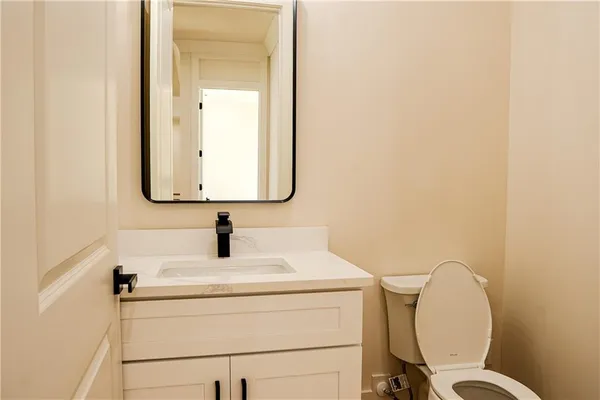 a bathroom with a toilet and a sink
