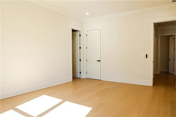 a view of room with wooden floor