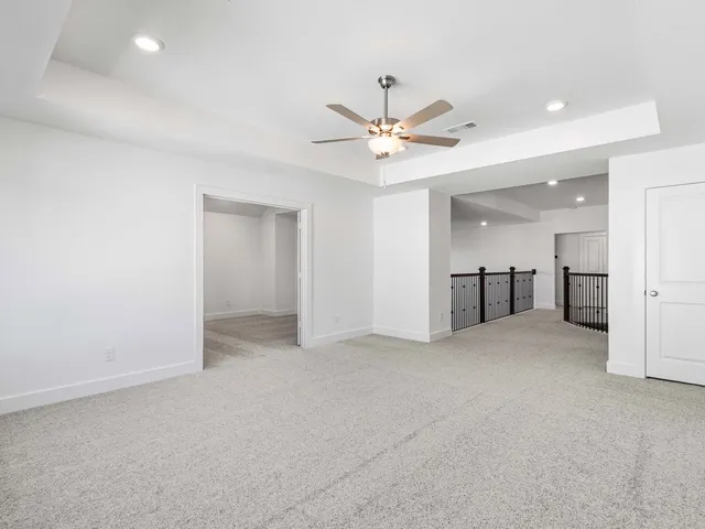 a kitchen with stainless steel appliances granite countertop a sink a stove a microwave a center island and cabinets