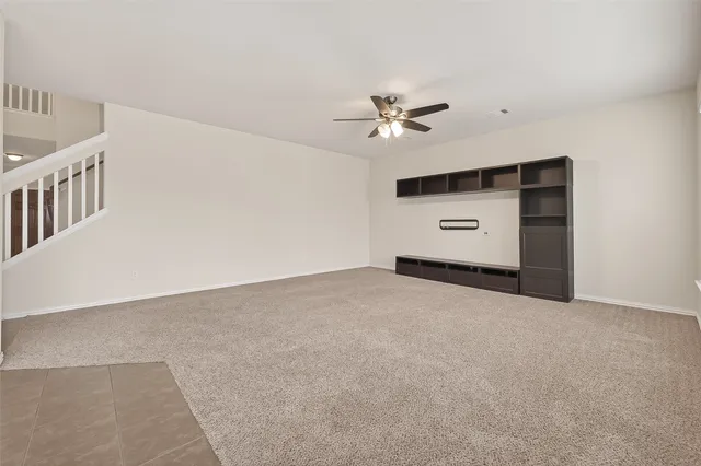 a view of an empty room with a fireplace