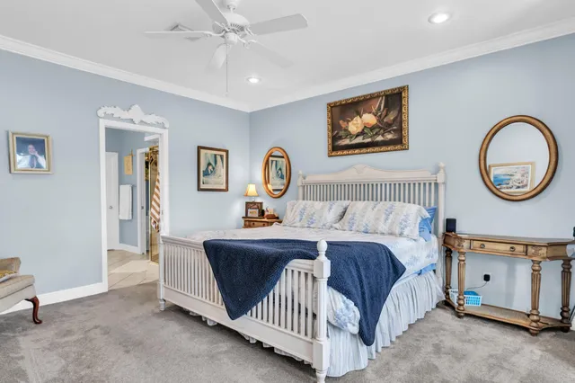 a bathroom with a white tub shower and mirror