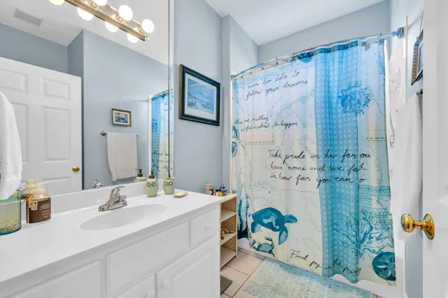 an empty room with windows and entryway