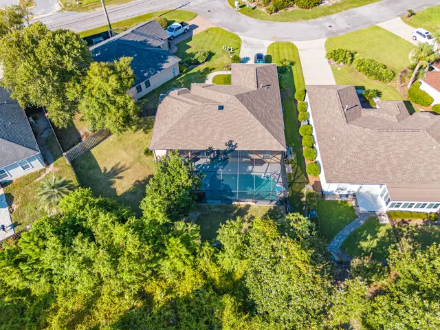 a view of house with swimming pool outdoor seating